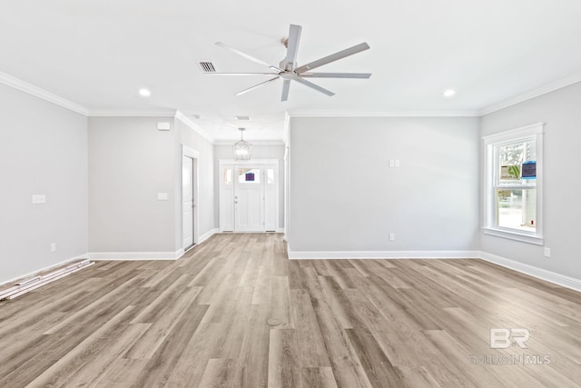 empty room featuring ceiling fan, light wood-type flooring, and ornamental molding