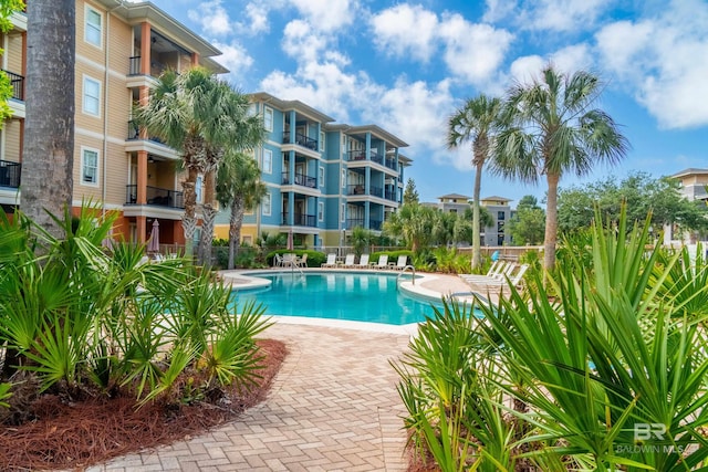 1430 Regency Rd Unit J302, Gulf Shores, AL 36542 - community pool with a patio and fence
