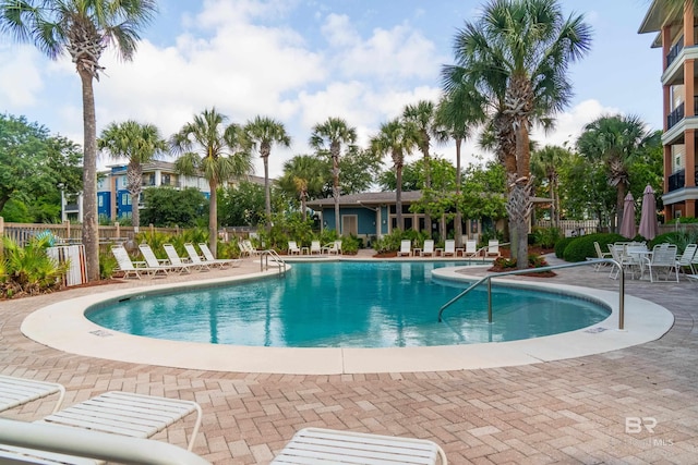 1430 Regency Rd Unit J302, Gulf Shores, AL 36542 - community pool featuring fence and a patio