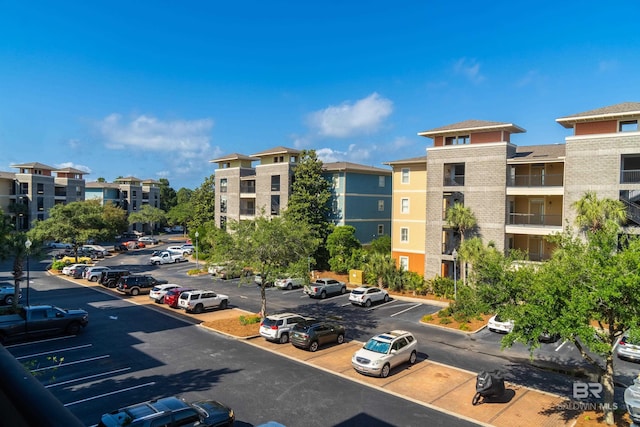 1430 Regency Rd Unit J302, Gulf Shores, AL 36542 - view of property featuring uncovered parking