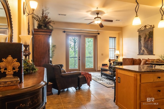 1430 Regency Rd Unit J302, Gulf Shores, AL 36542 - living area with ceiling fan and dark tile patterned floors