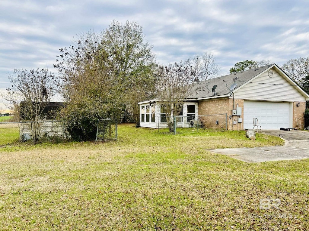 view of yard featuring a garage