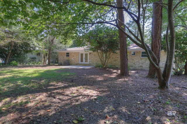 view of yard featuring french doors