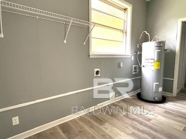 utility room with electric water heater