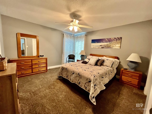 bedroom with ceiling fan, a textured ceiling, and dark colored carpet