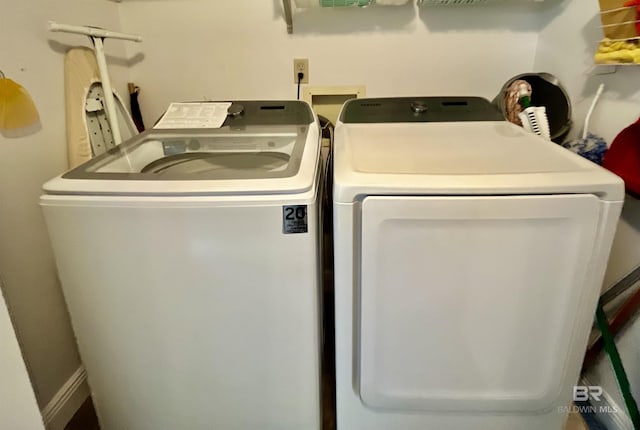 laundry area featuring washing machine and clothes dryer