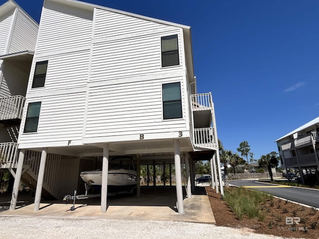 view of home's exterior with a carport