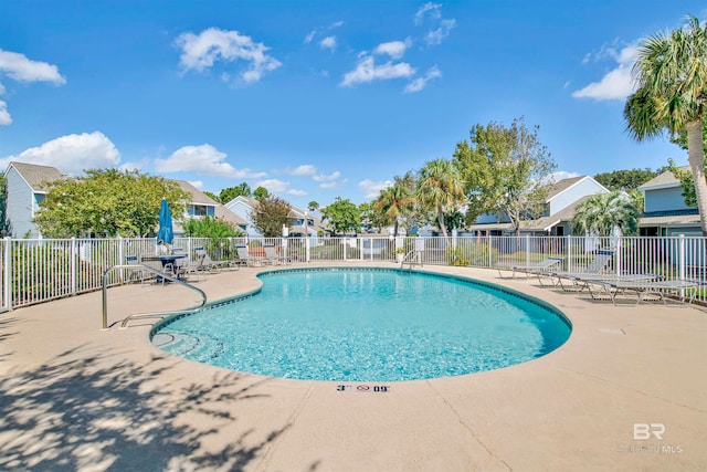 view of swimming pool featuring a patio area