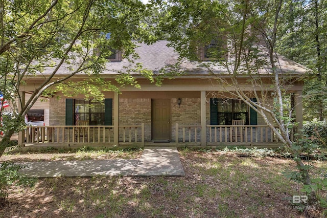 143 Kingswood Dr, Daphne, AL 36526 - view of front of house with covered porch, brick siding, and a shingled roof