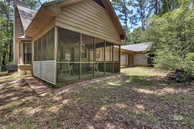 143 Kingswood Dr, Daphne, AL 36526 - view of side of home with a sunroom and a chimney