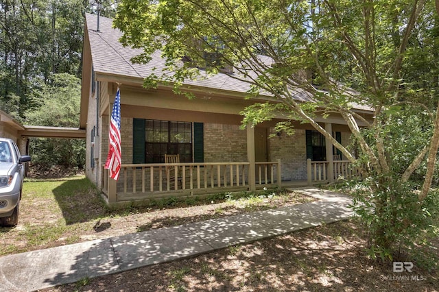 143 Kingswood Dr, Daphne, AL 36526 - view of front of property featuring covered porch, brick siding, and roof with shingles