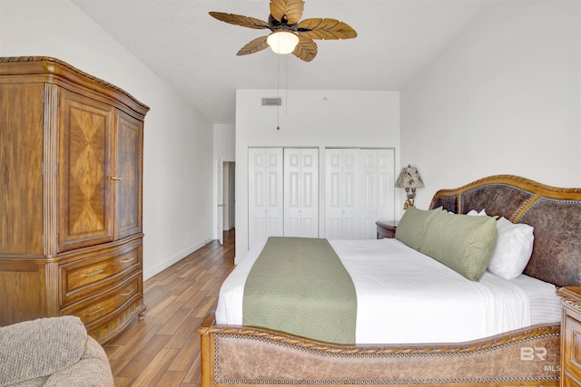 bedroom featuring hardwood / wood-style floors, a closet, and ceiling fan