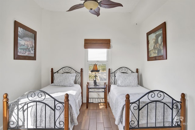 bedroom featuring hardwood / wood-style flooring and ceiling fan