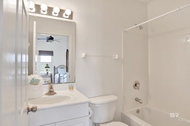 full bathroom featuring vanity, toilet, ceiling fan, and tub / shower combination