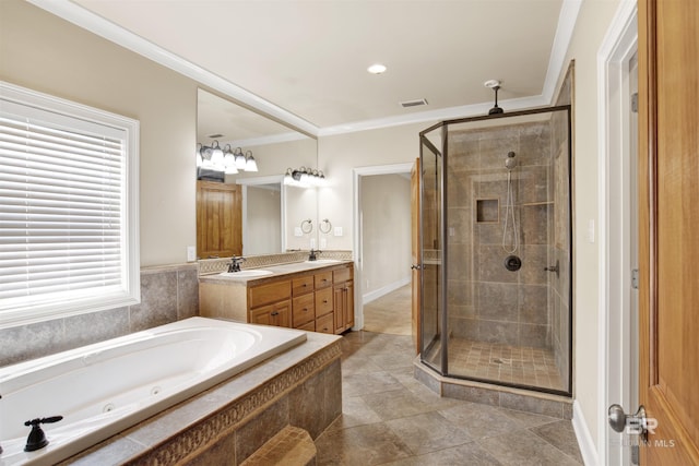 bathroom featuring a shower stall, ornamental molding, double vanity, and a garden tub