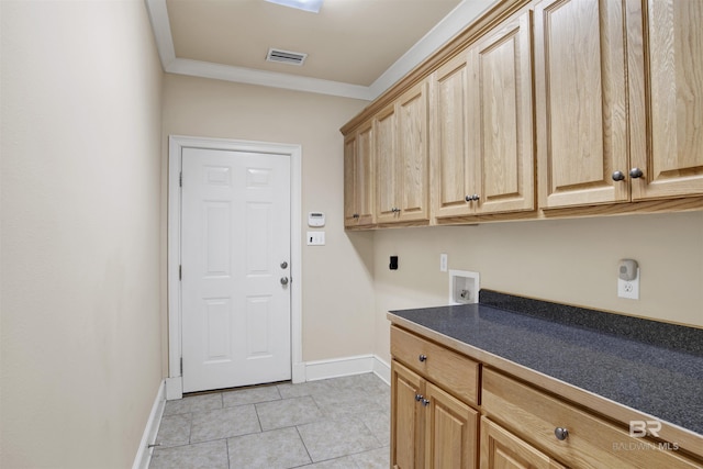 laundry area with cabinet space, baseboards, washer hookup, light tile patterned floors, and ornamental molding