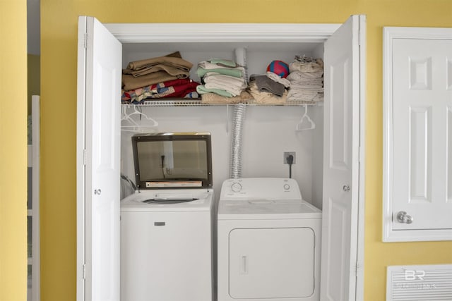 laundry area with independent washer and dryer