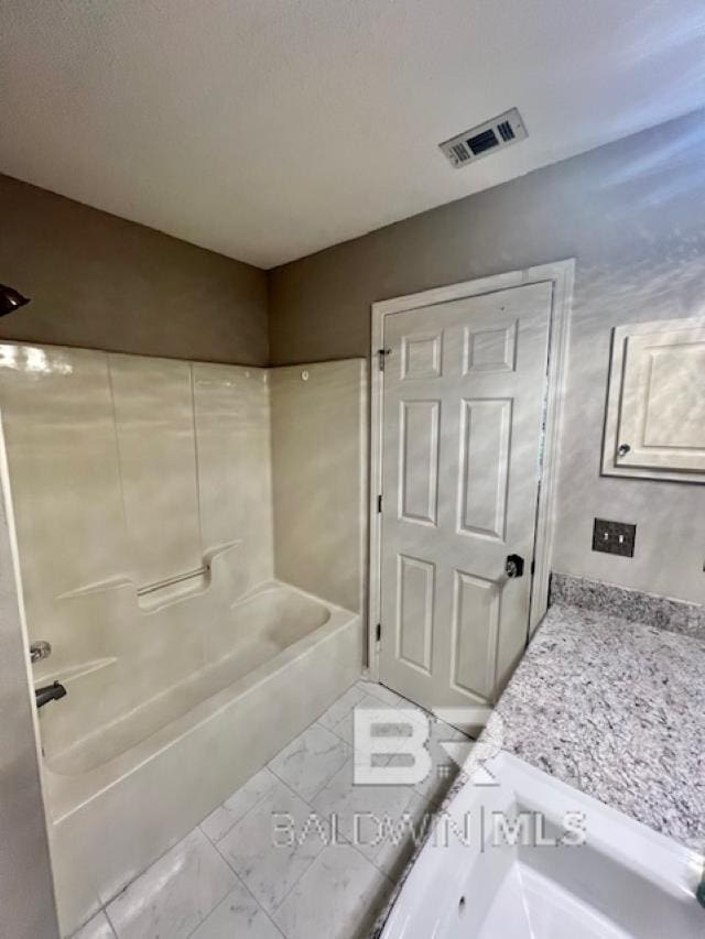 bathroom featuring shower / tub combination