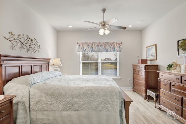 bedroom featuring light wood-type flooring and ceiling fan