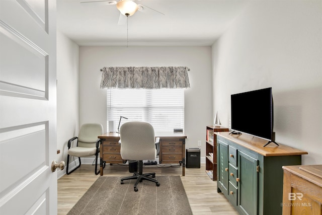 office area with ceiling fan and light hardwood / wood-style floors