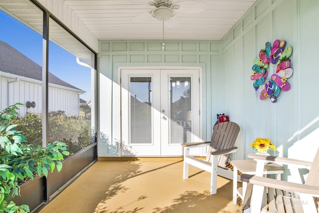 sunroom featuring ceiling fan and french doors