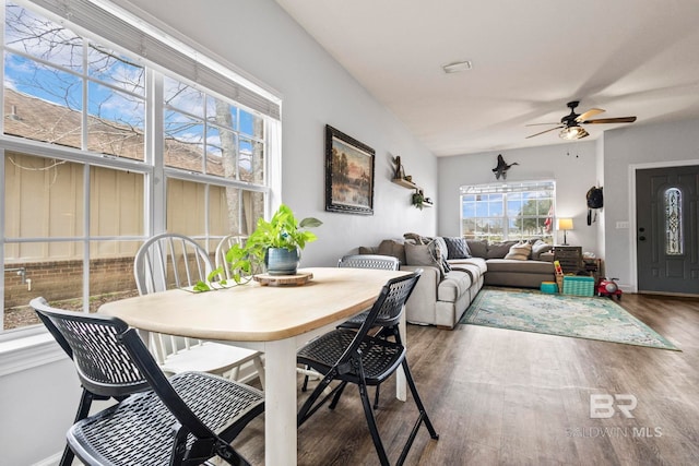 dining area with ceiling fan, dark wood finished floors, and baseboards