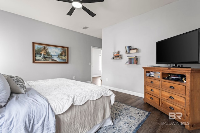 bedroom with a ceiling fan, dark wood-style flooring, visible vents, and baseboards