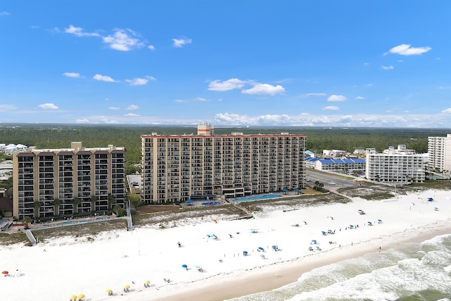 aerial view with a water view and a beach view