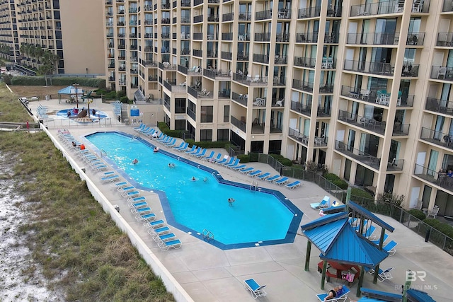pool featuring a patio area and fence