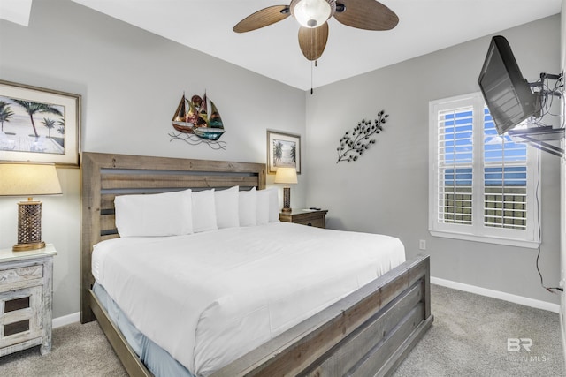 bedroom featuring ceiling fan, carpet flooring, and baseboards