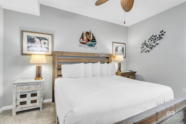 carpeted bedroom with baseboards and a ceiling fan