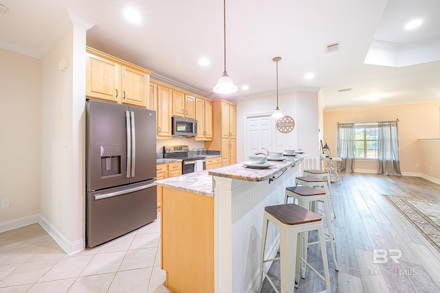 kitchen featuring pendant lighting, crown molding, appliances with stainless steel finishes, light stone countertops, and light brown cabinets