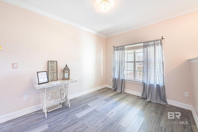 unfurnished room featuring hardwood / wood-style flooring and ornamental molding