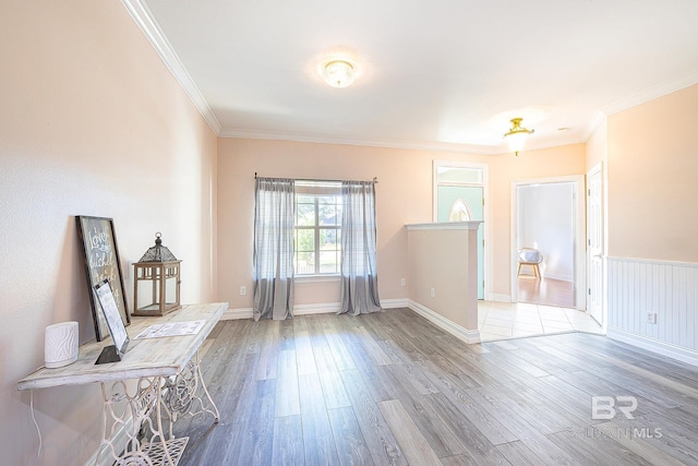 interior space with crown molding and light hardwood / wood-style floors