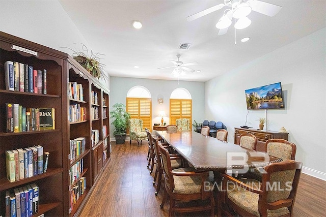 dining space featuring dark hardwood / wood-style floors and ceiling fan