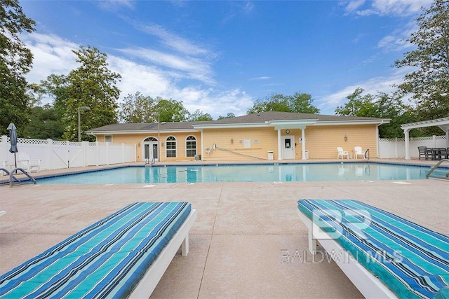 view of swimming pool with a pergola and a patio