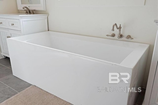 bathroom featuring tile patterned floors and vanity