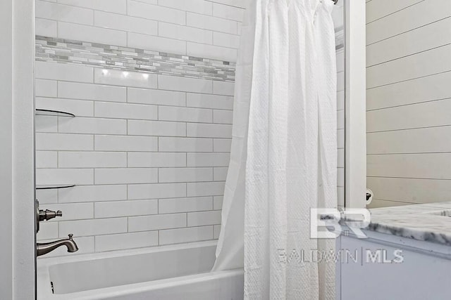 bathroom with vanity and shower / bath combo