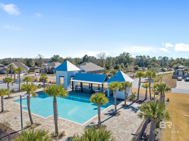 view of swimming pool featuring a patio area