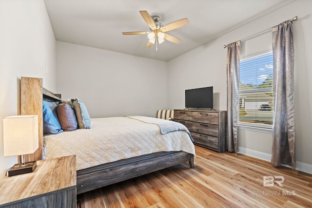 bedroom featuring ceiling fan and light hardwood / wood-style floors