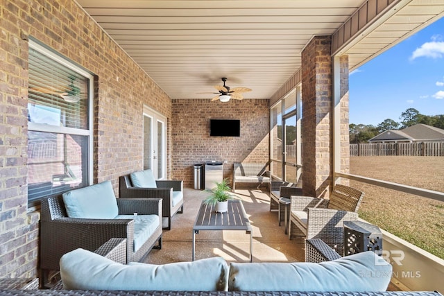 view of patio featuring an outdoor hangout area and ceiling fan