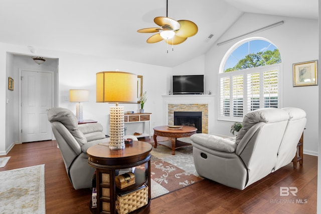 living room with ceiling fan, a fireplace, and dark hardwood / wood-style flooring