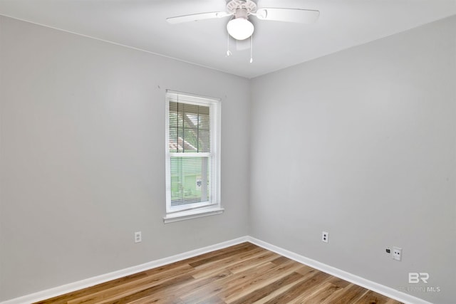 spare room featuring light wood-type flooring and ceiling fan