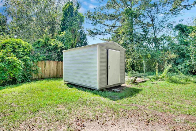 view of outdoor structure with a lawn