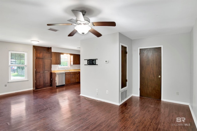 unfurnished living room featuring ceiling fan and dark hardwood / wood-style flooring