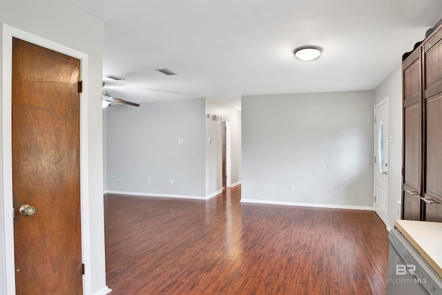 spare room with ceiling fan and dark wood-type flooring