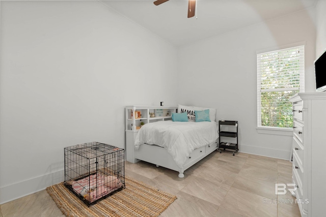 bedroom featuring ceiling fan and baseboards