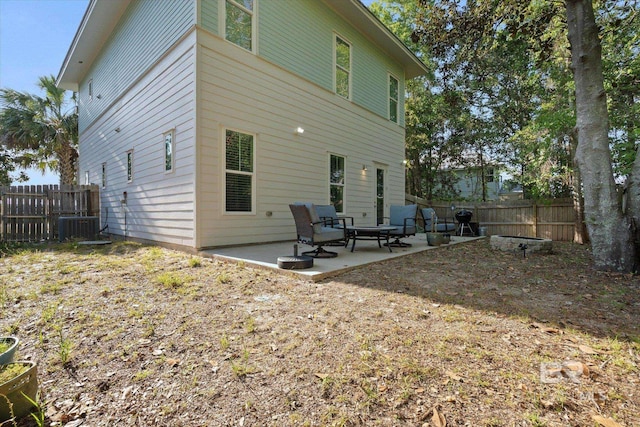 back of house with central air condition unit, a patio area, and fence private yard