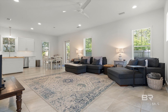 living room featuring recessed lighting, visible vents, and ceiling fan
