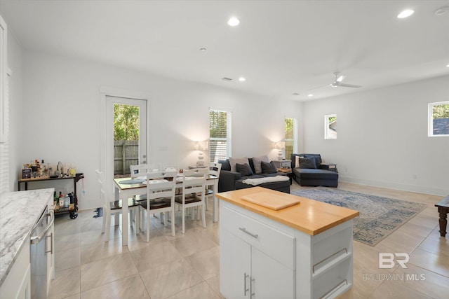 kitchen featuring recessed lighting, open floor plan, wooden counters, and ceiling fan